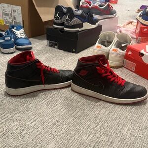 Jordan 1 Mid Black and Red Sneakers